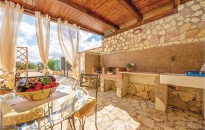 a kitchen with a bowl of fruit on a table at App,to Fiordaliso in Balestrate