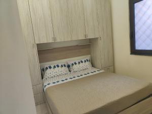 Giường trong phòng chung tại Pompei Priscus II Casa Vacanza