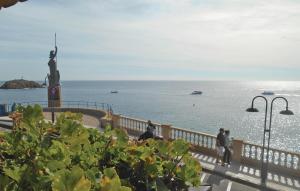 a group of people standing on a pier near the water at Lovely Apartment In Tossa De Mar in Tossa de Mar