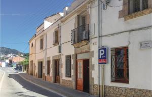 a street with a parking sign next to a building at 3 Bedroom Beautiful Apartment In Pineda De Mar in Pineda de Mar