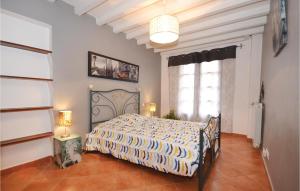 a bedroom with a bed and a large window at Amazing Home In St Martin De Castillon in Saint-Martin-de-Castillon +19 photos