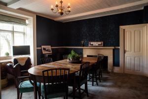 a dining room with a table and chairs at Halford House - Adults Only in Bourton on the Water