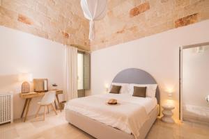 A bed or beds in a room at Palazzo Manzoni by MANZONI COLLECTION