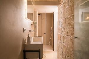 A bathroom at Palazzo Manzoni by MANZONI COLLECTION