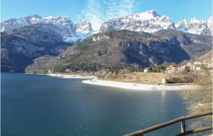 a large body of water with mountains in the background at Lovely Home In Fai Della Paganella in Fai della Paganella