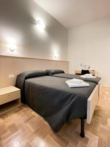 Posteľ alebo postele v izbe v ubytovaní Villino Milano