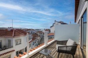 a balcony with a view of the city at Reserva FLH Hotels Ericeira in Ericeira