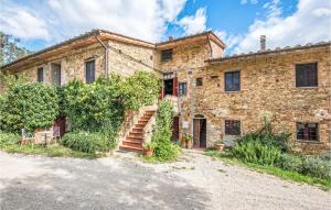 an old stone house with stairs in front of it at Travicello 1 in Gambassi Terme