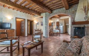 a living room with a couch and a fireplace at Gallonero 2 in Tavarnelle Val di Pesa