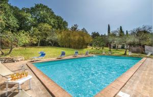 a swimming pool with two chairs and a table at Piedimonte in Terni