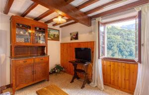 a living room with a television and a window at Casa Firma in Casoli