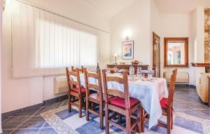 a dining room with a table and chairs at Lovely Home In Ca- With Wifi in Monte Nai +13 photos