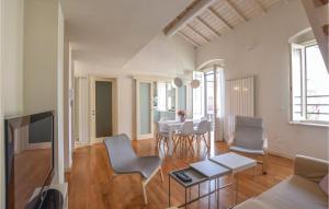 a living room with a table and chairs at Villino Anna in Viareggio