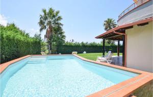 a swimming pool in the backyard of a house at Stunning Home In Sangineto Lido in Belvedere Marittimo +12 photos