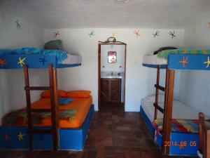 Voodi või voodid majutusasutuse Hosteria Tsafiki toas