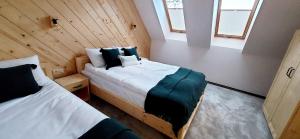 Gulta vai gultas numurā naktsmītnē Tatra Apartament