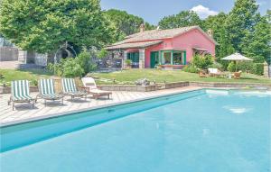 a house with a swimming pool in front of a house at Villa Agata in Latera +20 photos