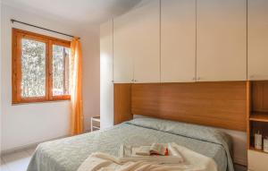 a bedroom with a bed with a tray on it at Trilo 6 in San Teodoro