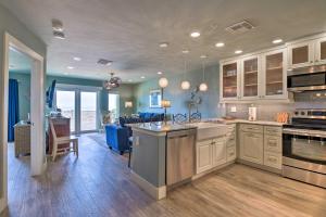 a kitchen and living room with an open floor plan at Beachfront Port Aransas Condo with Ocean Views! in Port Aransas