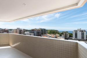 a balcony with a view of the city at Hotel Mirante do Forte in Cabo Frio