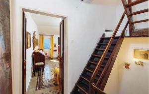 a hallway with a staircase leading to a living room at Golfopoeti in Fiascherino +8 photos