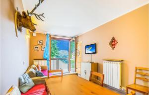 a living room with a couch and a window at Borgo Stalle Trilo L29 in Frabosa Sottana