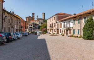 a cobblestone street in a town with cars parked at Borgo Stalle Trilo L29 in Frabosa Sottana