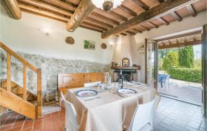 a dining room with a table with white table cloth at Holiday Home Loc Borgacciano in Monterchi +7 photos