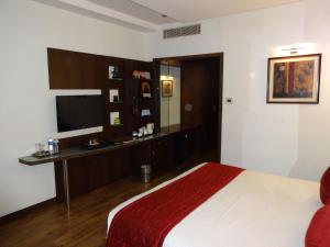 Postel nebo postele na pokoji v ubytování Regency Madurai by GRT Hotels