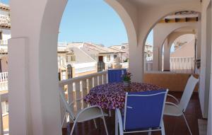 a table and chairs on a balcony with a view at 2 Bedroom Lovely Home In Orihuela Costa in Orihuela Costa