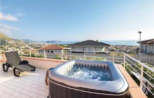a hot tub on the balcony of a house at Beautiful Home In Tortora Praia A Mare in Praia a Mare
