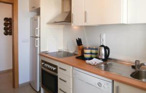 a small kitchen with a sink and a stove at Hacienda Riquelme in Sucina