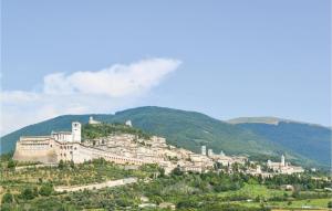 a town on top of a hill with trees at Gioiara in Valfabbrica