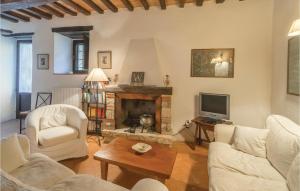 a living room with white furniture and a fireplace at Alabarda in Vasciano Nuovo