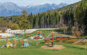 a playground in a park with mountains in the background at Al Ginco in Vellai