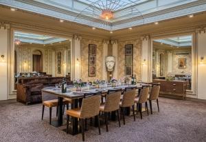 a large dining room with a long table and chairs at Hotel Litteraire Le Swann, BW Premier Collection in Paris