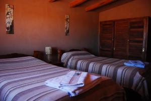Posteľ alebo postele v izbe v ubytovaní Complejo Pucara