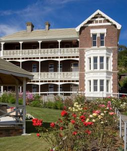 a large house with flowers in front of it at Auldington Hotel in Launceston