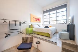 Posteľ alebo postele v izbe v ubytovaní Loft 19