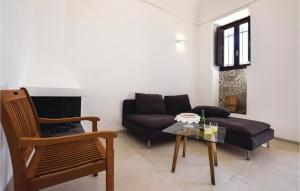 a living room with a couch and a table at Villa Della Marchesa in Santa Croce Camerina