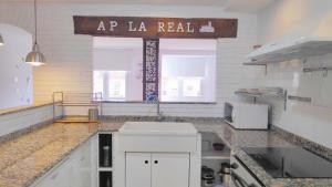 a kitchen with a sign that reads ap la real at APARTAMENTO LA REAL in Nájera