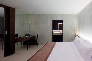 a bedroom with a bed and a table and a desk at Nine Forty One Hotel in Bangkok +40 photos