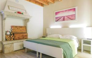 A bed or beds in a room at La Casa Delle Api