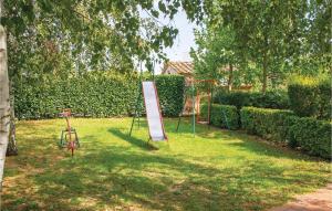 a park with a sign and a swing set at Il Nido in Panicarola