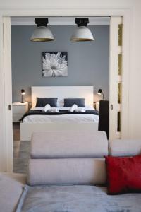 Postel nebo postele na pokoji v ubytování Les Capucins - 3 bedroom apartment near the city