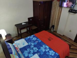 Postel nebo postele na pokoji v ubytování HOTEL VELANEZ SUITE Riobamba