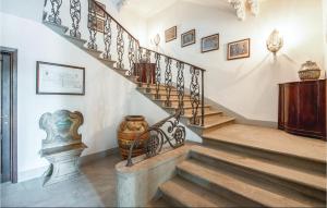 a staircase in a house with a vase on the wall at Villa Di Collina in Vicchio