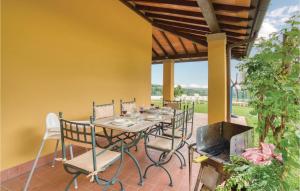 a dining table and chairs on a patio at Brunese in Massa