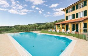 a swimming pool in front of a house at Brunese in Massa