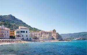 a group of people on a beach near the water at Villa Marisa in Perdifumo